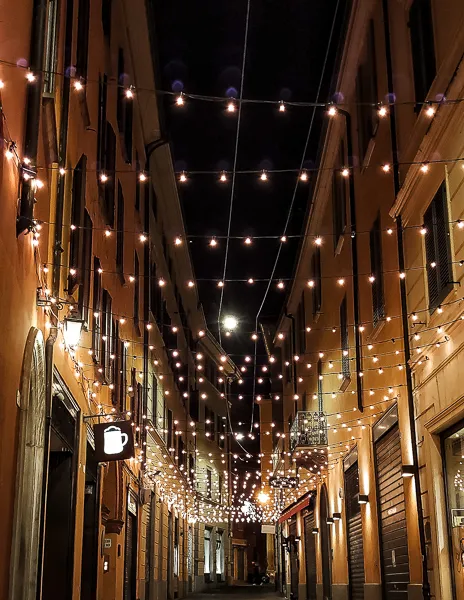 christmas lights hung on a street in Bologna italy