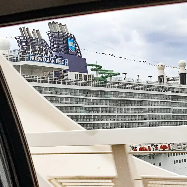 view of norwegian epic cruise ship from taxi ride to barcelona cruise port