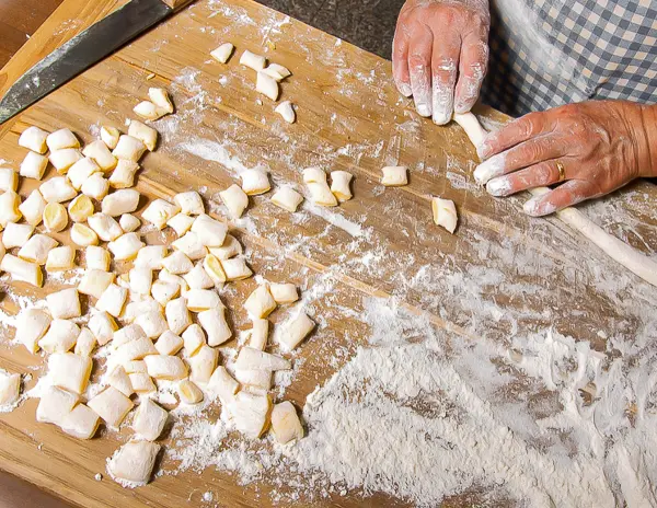 hands rolling and making gnocchi pasta
