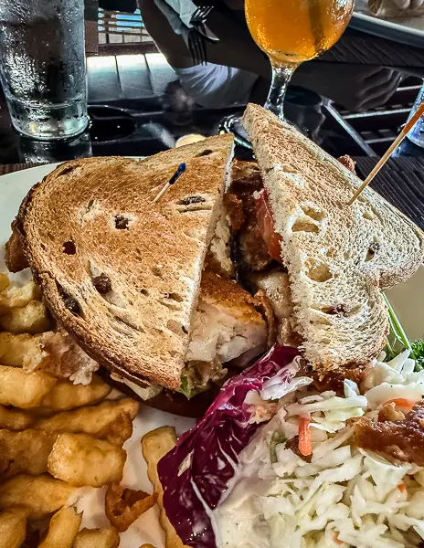 Bermudian fish sandwich on raisin bread from Wahoo’s Bistro with fries and coleslaw.
