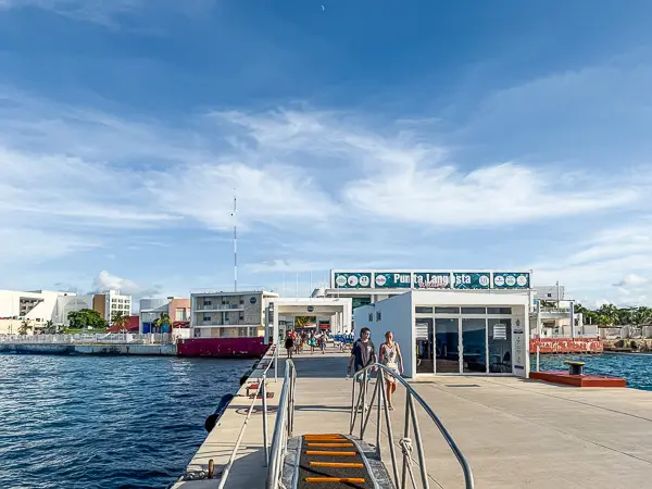 Cozumel cruise port pier at Punta Langosta with passengers walking toward the terminal