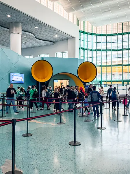 Disney Cruise Line passengers waiting to board at the cruise ship