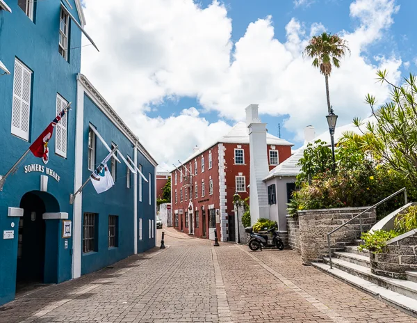 colorful structure, palm tree and cobblestone street in st. george bermuda