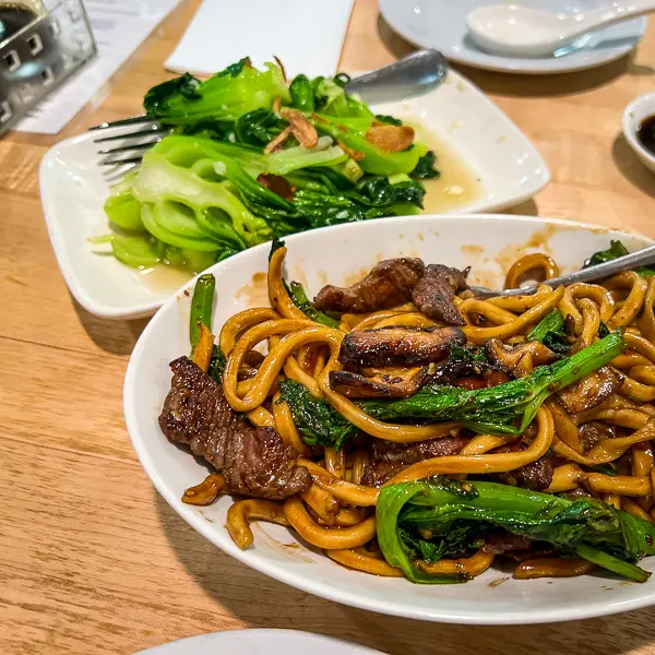 short rib noodles with a side of bok choy at dan modern chinese