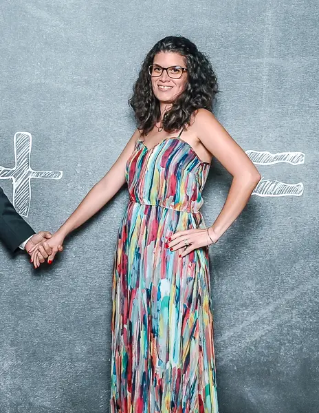 woman in a chic colorful dress on formal night on cruise vacation