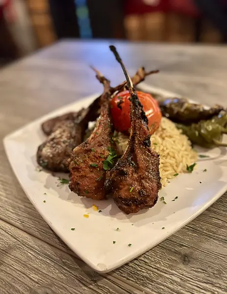 grilled lambchops over a bed or rice pilaf at the diplomat