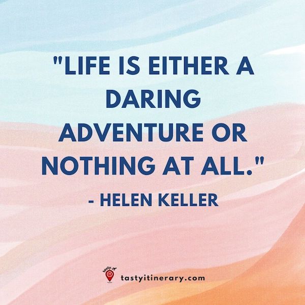 graphics of helen keller qoute, pink and blue background with text that says, life is either a daring adventure or nothing at all. 