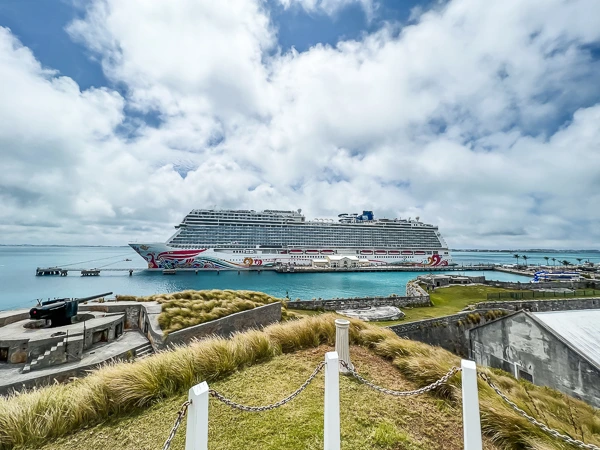 view of norwegian joy cruise ship from the grounds of the national museum of bermuda