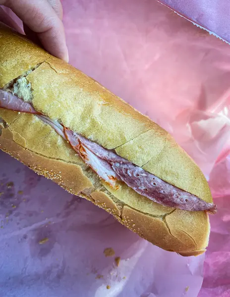 a sandwich with pink background