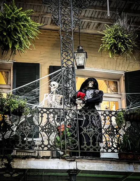 skeletons on a balcony in the french quarter