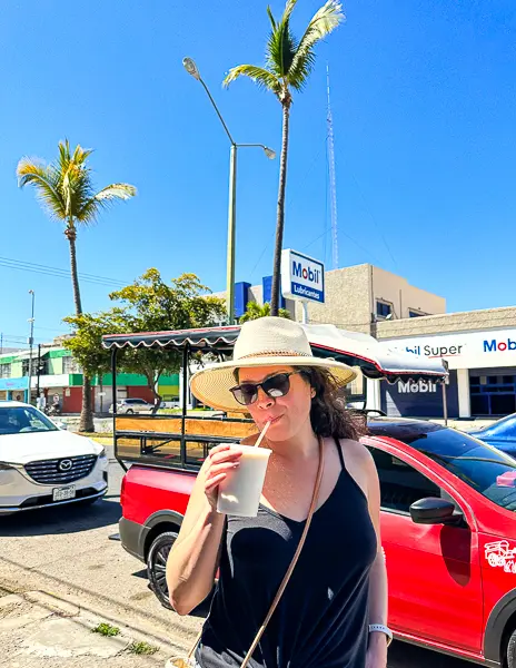 drinking coconut milkshake in mazatlan