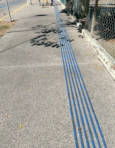 blue lines painted on the side walking in mazatlan