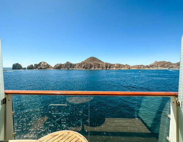 view of cabo san lucas land's end rock formations from portside cruise cabin balcony