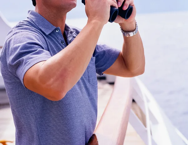 male cruise passenger wearing a polo shirt on a cruise