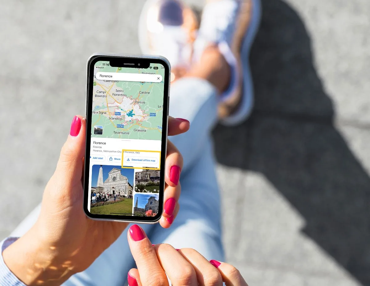 female hands with pink finger nails holding a phone with a screenshot of google maps, yellow square drawn around download offline map