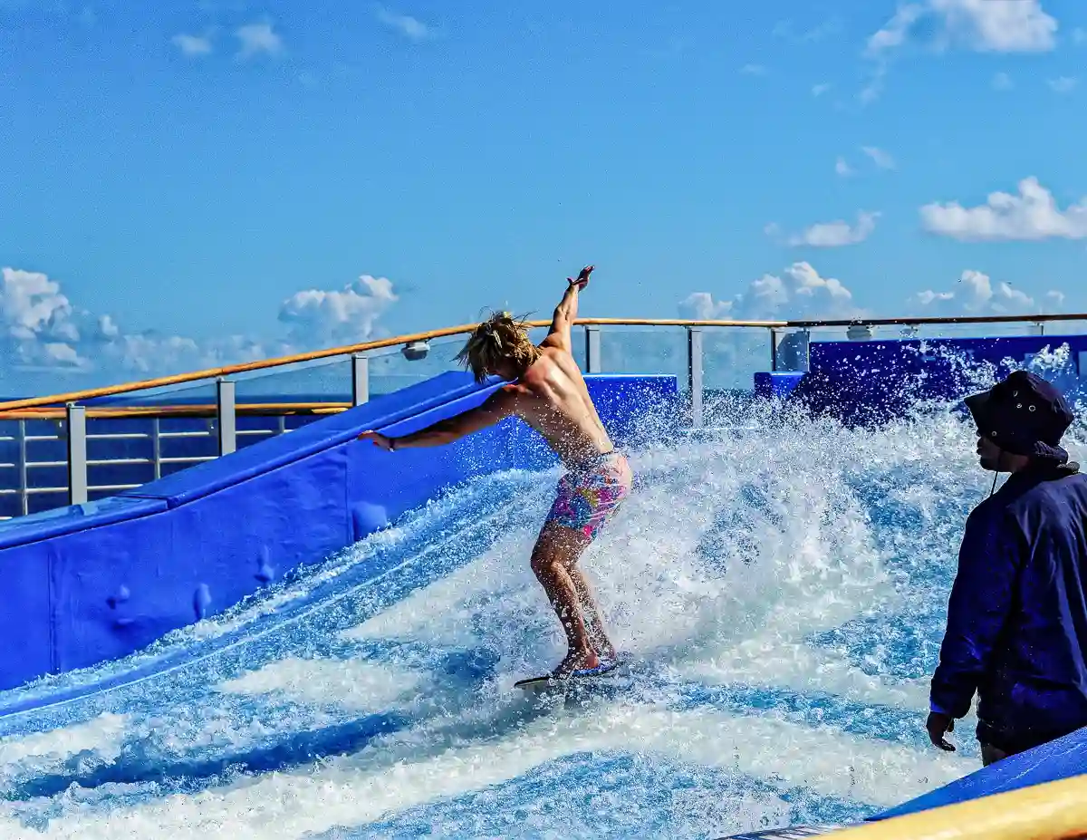 young man surfing the royal caribbean flowrider