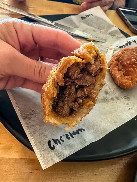 beef filling inside a an empanada