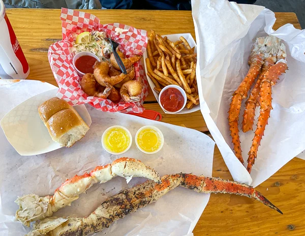 a feast of alaskan king crab legs and beer battered shrimp with fries in Ketchikan, Alaska