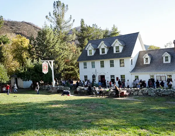 The Hawks Head Tavern building at Riley's Farm with visitors outside
