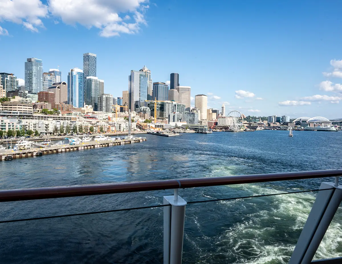 sailaway from seattle cruise port, seattle city skyline from the aft of a cruise ship