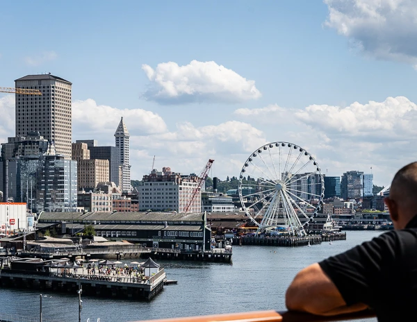 man staring at the great sheel in the seattle skyline