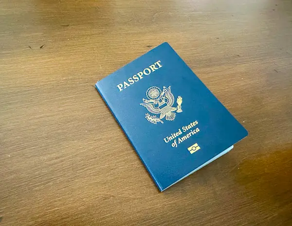 united states passport on a wooden table