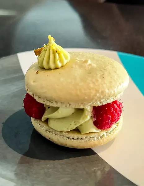 pistachio macaron with raspberries from the sweet side scaret lady
