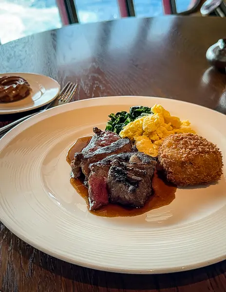 steak, eggs and a hash brown from the wake on scarlet lady brunch