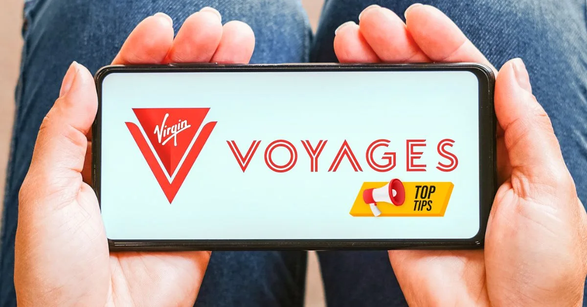 featured blog image A person holding a smartphone horizontally with both hands, displaying the Virgin Voyages logo and the words "VOYAGES TOP TIPS" in a banner across the bottom | virgin voyages tips