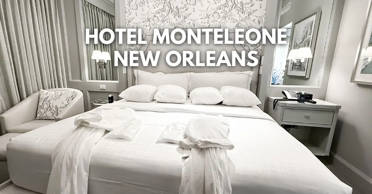 featured blog image: Hotel room at Hotel Monteleone in New Orleans with a neatly made bed, white robes laid out, elegant neutral décor, and the overlay text ‘Hotel Monteleone New Orleans’ centered above the bed.