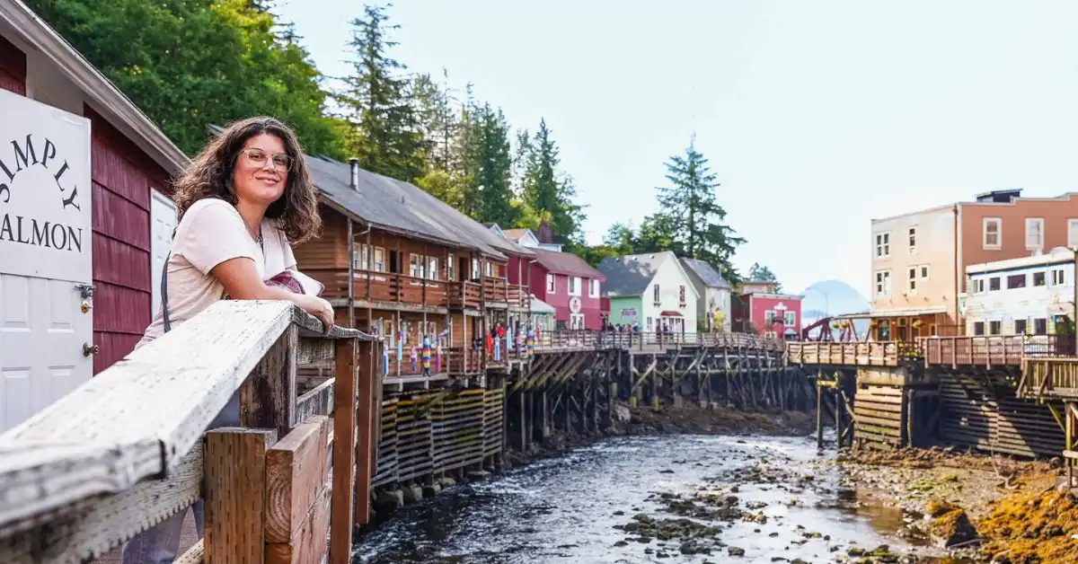 Standing along the boardwalk at Creek Street in Ketchikan, Alaska during a cruise stop, featured in the blog post “How We Spent Half a Day in Ketchikan, Alaska on a Cruise.”