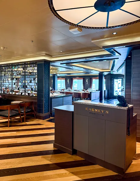 Host stand and entrance to Cagney’s Steakhouse on Norwegian Encore, photographed after the 2024 dry dock.