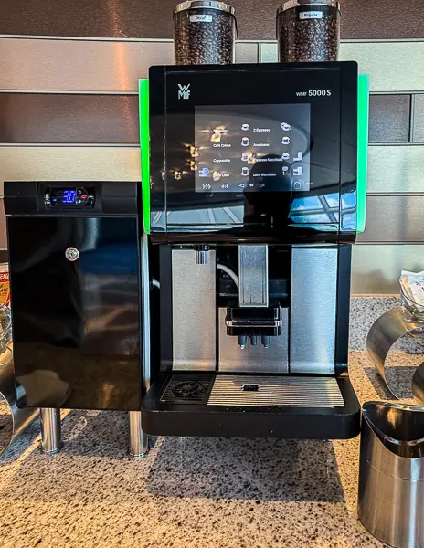 Self-serve specialty coffee machine in The Haven Observation Lounge on Norwegian Encore, available throughout the day