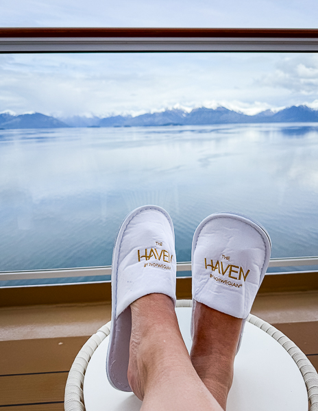 Relaxing on the balcony of Haven Suite 17112, watching the Alaskan scenery go by in comfort.