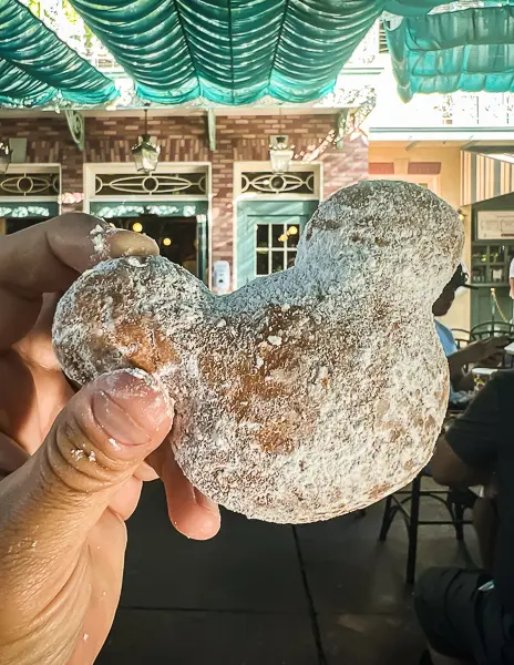 Mickey-shaped beignet covered in powdered sugar at the Mint Julep Bar in Disneyland.