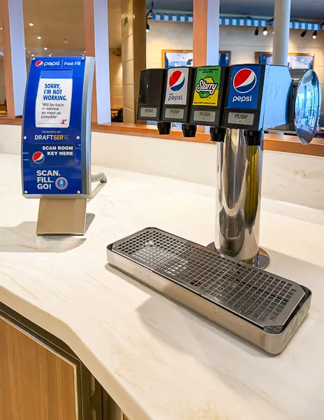 A Pepsi soda fountain on a Carnival cruise ship offering Pepsi, Diet Pepsi, and Starry lemon-lime soda.