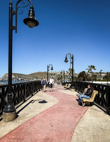 Pedestrian bridge with lampposts outside Cruiseport Village in Ensenada, Mexico, used by cruise passengers walking into town.