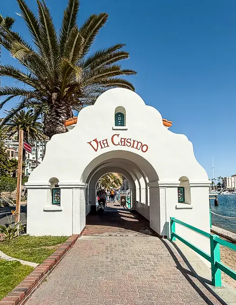 Via Casino archway along the promenade in Avalon, Catalina Island, leading toward the historic Catalina Casino.