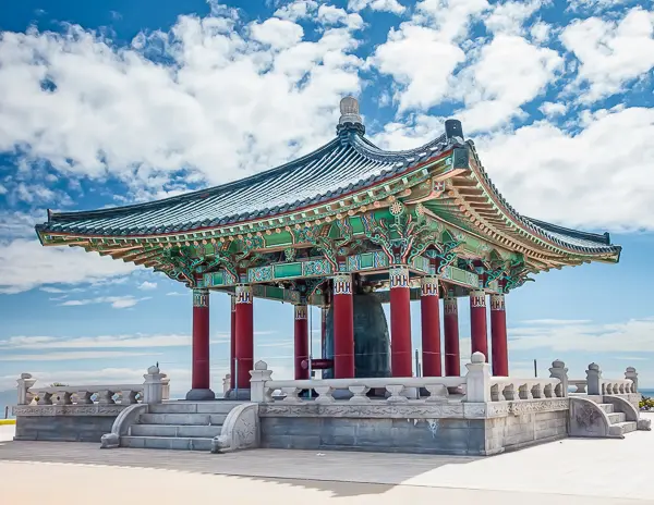 The Korean Friendship Bell in San Pedro, a colorful pavilion overlooking the ocean on a clear day.