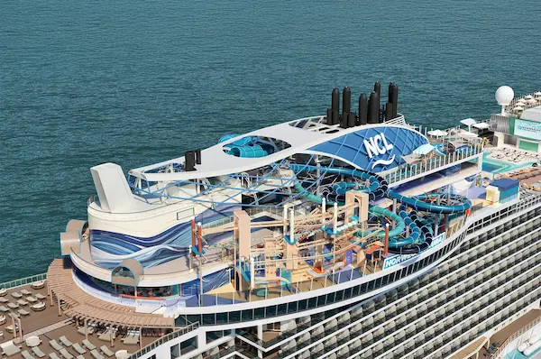 Aerial rendering of Norwegian Aura highlighting the Ocean Heights complex with multiple waterslides, ropes course, and open air activity areas on the top decks.