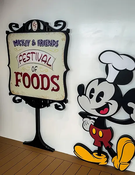 Mickey & Friends Festival of Foods sign with Mickey Mouse graphic on Disney Treasure.