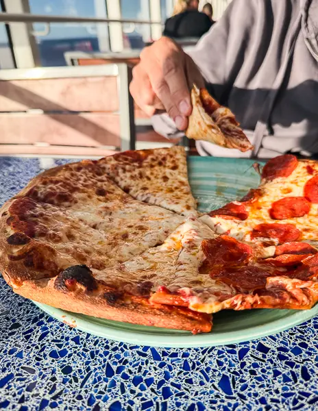 Cheese and pepperoni pizza from Daisy’s Pies at Festival of Foods on Disney Treasure.
