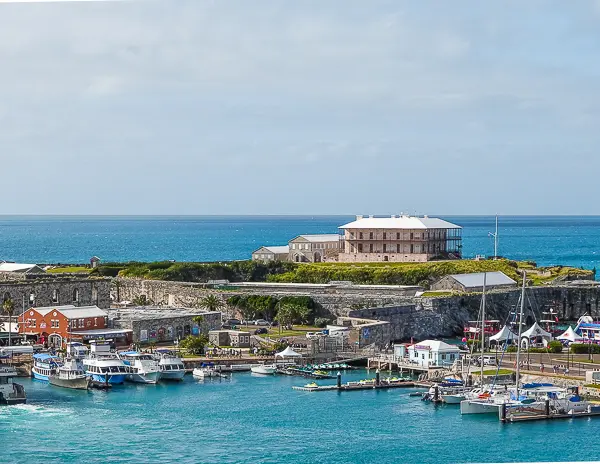 Royal Naval Dockyard in Bermuda with the marina, historic fort walls, and Commissioner’s House, a helpful area to know when planning Bermuda cruise port tips.