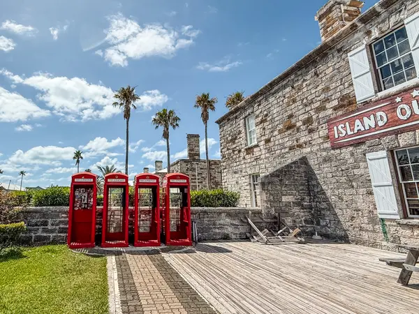 Red British phone boxes outside Island Outfitters at Royal Naval Dockyard in Bermuda.