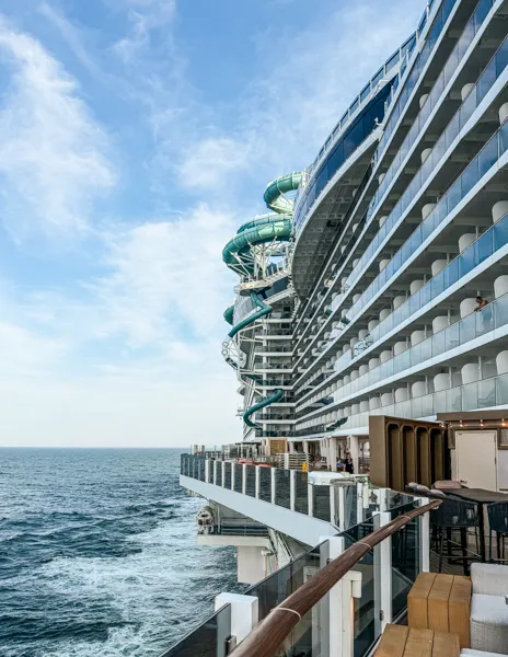 Norwegian Aqua port side with balconies, Aqua Slidecoaster, and ocean views from the outdoor deck.