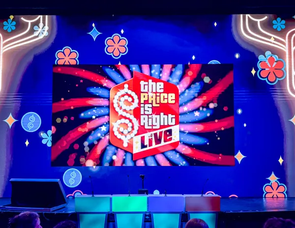 The Price Is Right Live stage setup inside the Norwegian Aqua theater.