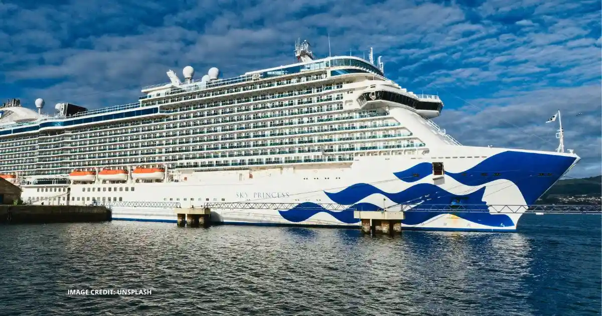Sky Princess cruise ship docked in port under a blue sky.