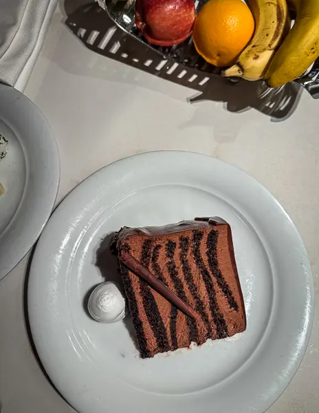Seven-layer chocolate cake from the NCL Haven room service menu delivered to a Haven suite by the night butler.